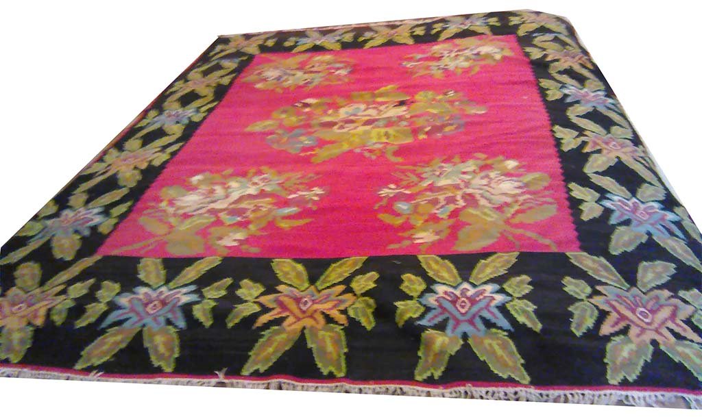 AUBUSSON CARPET: A nice Aubusson carpet in tones of black, green, blue and ivory on a rose ground. Good condition. Measures: 8'6" x 10'.