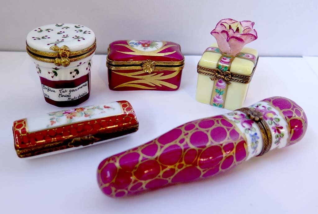 GROUP OF FIVE LIMOGES BOXES: A group of five Limiges boxes in different shapes and sizes. All signed Limoges, France. All in good condition. The largest measures: 4Â¾" L x 1Â¼" W x Â¾" D.