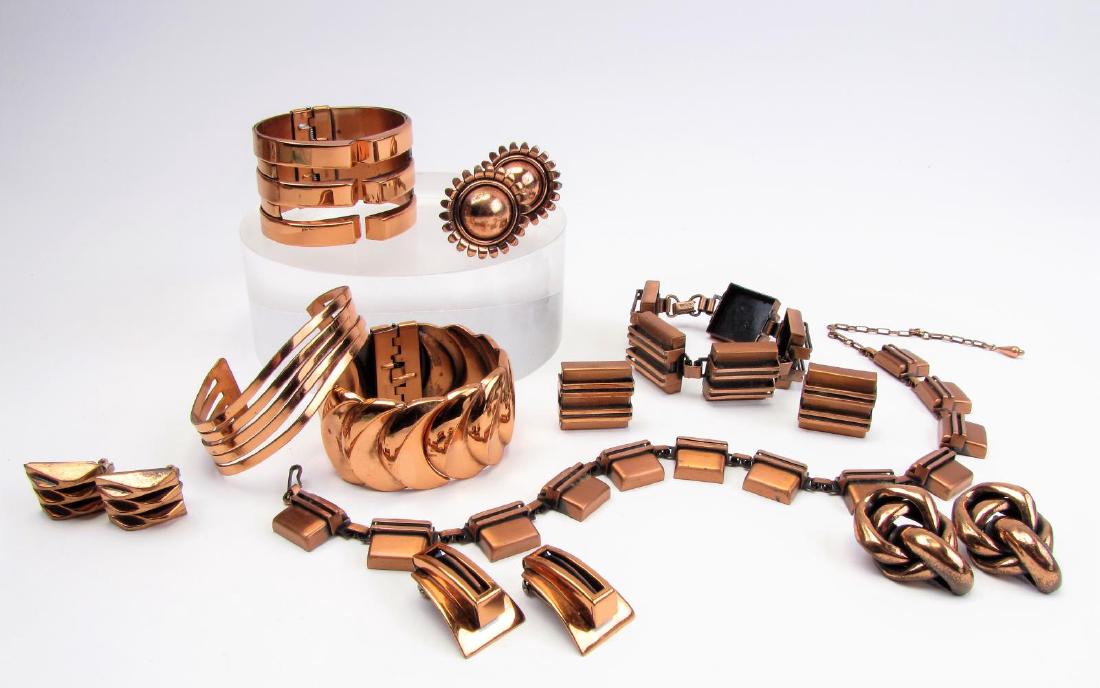 Collection of Vintage Renoir Copper Jewelry: A collection of fifteen vintage Renoir copper jewelry items including two wide hinged cuff bracelets; an open cuff bracelet; a matching bracelet and earrings suite; a necklace; and four additional pai