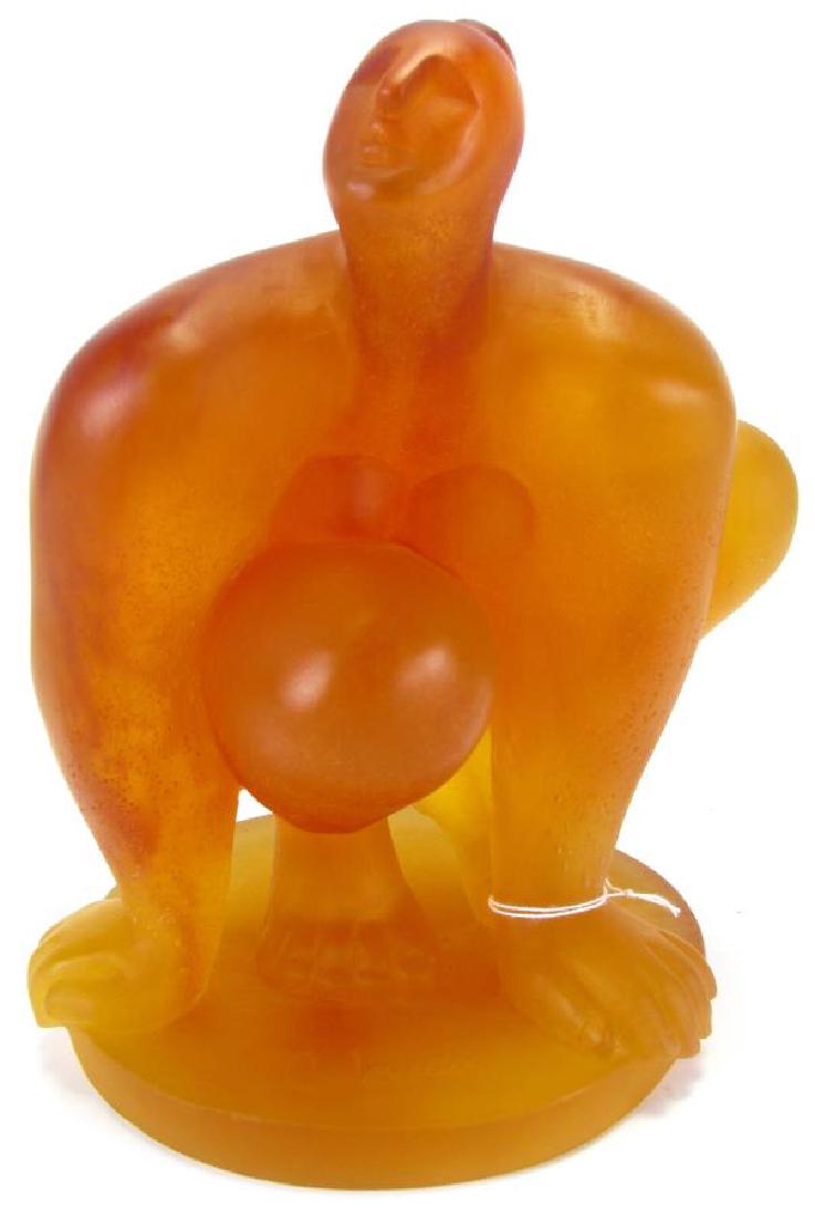 Catherine Lorain for Daum France Glass Sculpture: Catherine Lorain for Daum France Glass Sculpture entitled "La Banista", Catherine Lorain (France, b.1941), amber glass sculpture depicting a squatting figure with oversize features, signed "C.Lorain, 