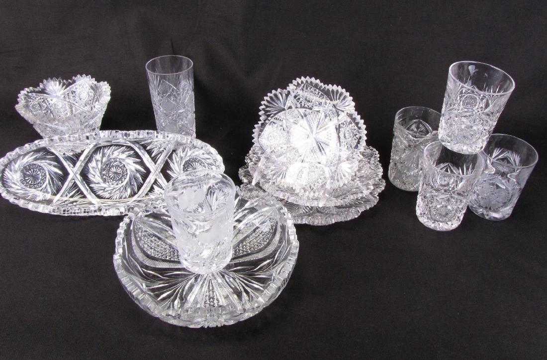 Group of Fine Cut Glass Tableware: Group of Fine Cut Glass Tableware, 12 pieces total including: three round dishes with saw tooth rim; bowl with scalloped and saw tooth rim; bowl with cut floral decoration; celery dish; six glasses wi