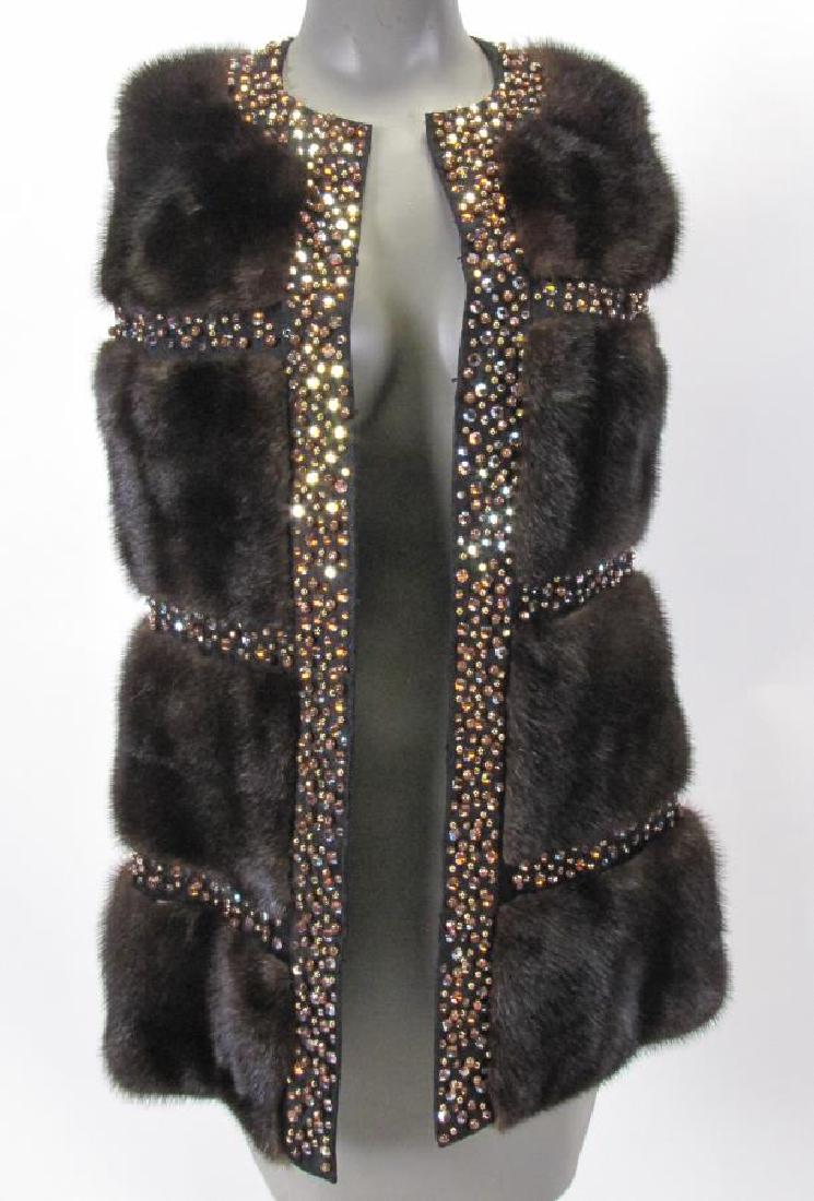 Lady's Geoffrey Beene Black Ebony Mink Vest: A lady's Geoffrey Beene black ebony natural mink vest, with rhinestone trim, hook and eye closure, Davidson's Furs label, size approx M, 27"l