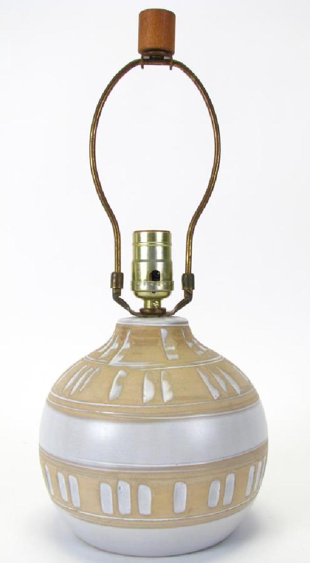 Gordon and Jane Martz Art Pottery Table Lamp: Gordon and Jane Martz Art Pottery Table Lamp, tan spherical base with cream glaze and decorative bands encircling the body, cylindrical wood finial, signed "Martz" on bottom edge near cord, no shade,