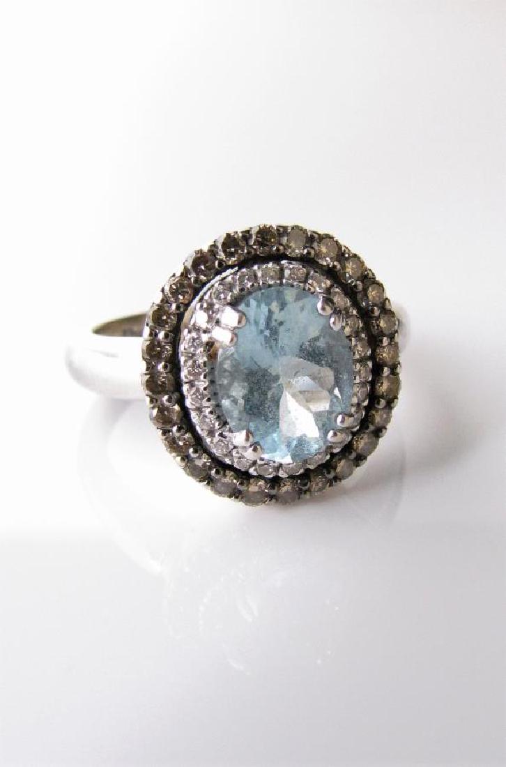 Le Vian 14K White Gold Aquamarine, Diamond Ring: A 14K white gold ring by Le Vian featuring an approximately 9mm x 8mm oval aquamarine, inside a double halo featuring twenty-two round white diamonds in interior halo and twenty-three light brown choc