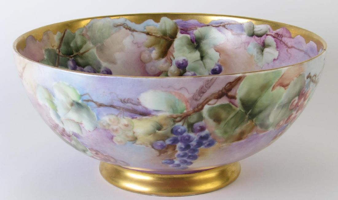 Joseph Schachtel German Porcelain Punch Bowl: Joseph Schachtel German Porcelain Punch Bowl, hand painted bowl with grape and leaf decoration, gilt gold decorated foot and rim, signed and dated on bottom "Myrtle Hart Fritz, 1909" with J.S. Germany