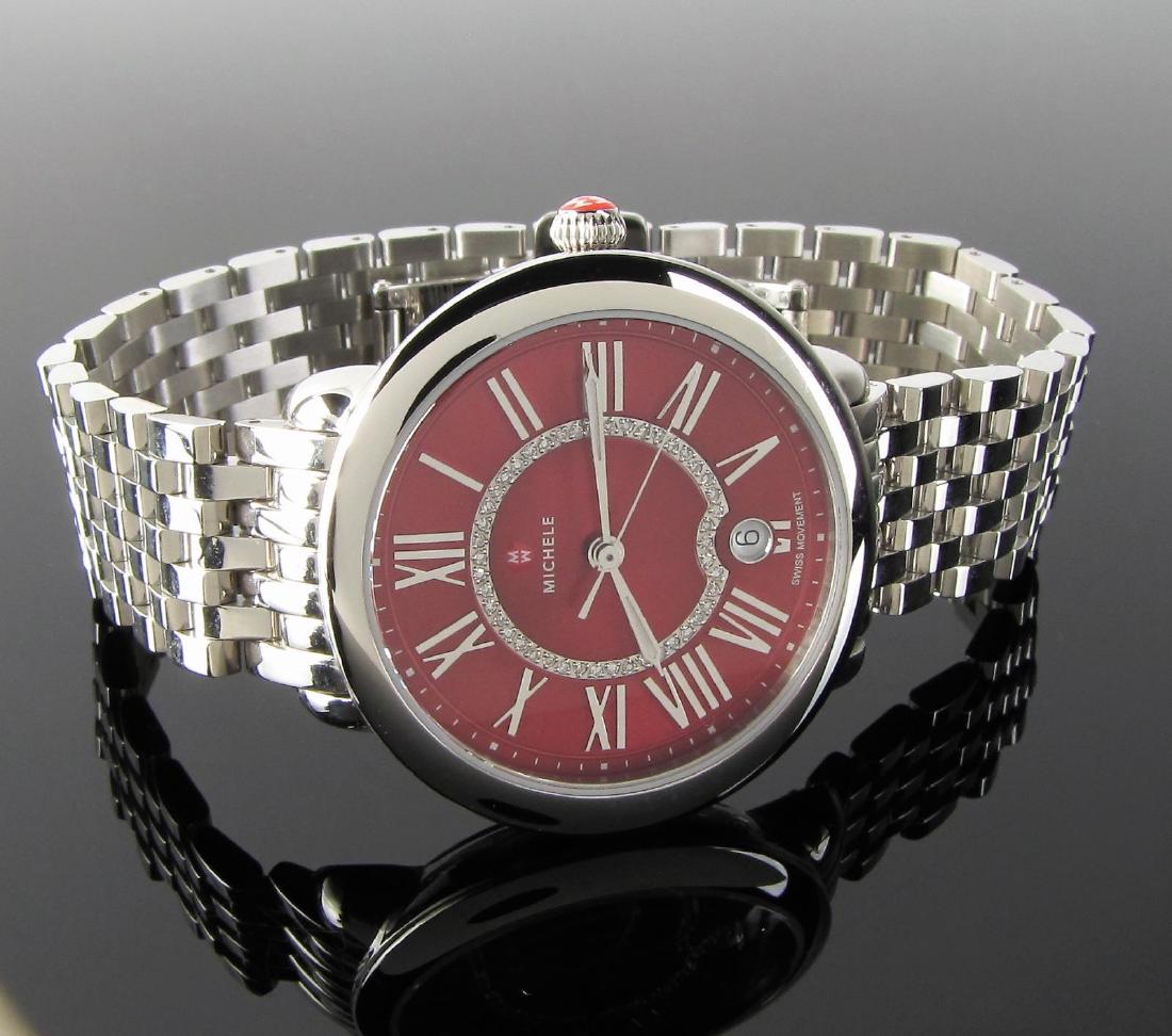 Michelle Serein Red Dial Diamond Wristwatch: Never worn, new with box, Michelle, stainless steel, wristwatch, Serein, Red dial with diamond lace inner bezel, quartz movement with stainless steel bracelet, deployant buckle