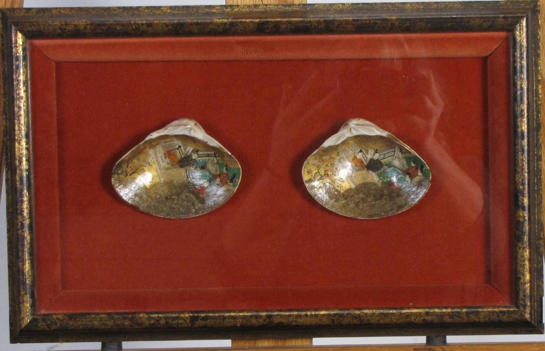 Pair of Handpainted Japanese Seashells: A pair of hand-painted Japanese seashells, ca mid 19th century, restored 1972 by a Korean man, paintings depict figures and buildings, size as framed 10 x 16 x 2