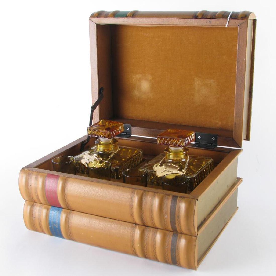 Library Hidden Liqueur Set: Library Hidden Liqueur Set, three faux books open to reveal a six piece amber glass liqueur set, having two decanters with "Gin and Scotch" badges and four shot glasses, 11" x 8" x 6" high