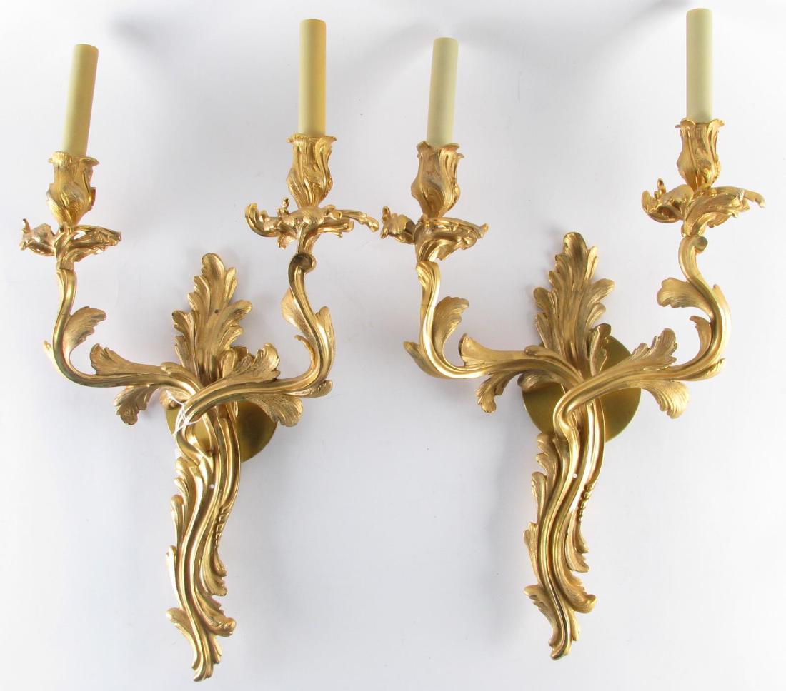 Pair of Louis XV Style Bronze Wall Sconces: Pair of Louis XV Style Bronze Wall Sconces, two light wall sconces with floral motif, electrified, 20" long