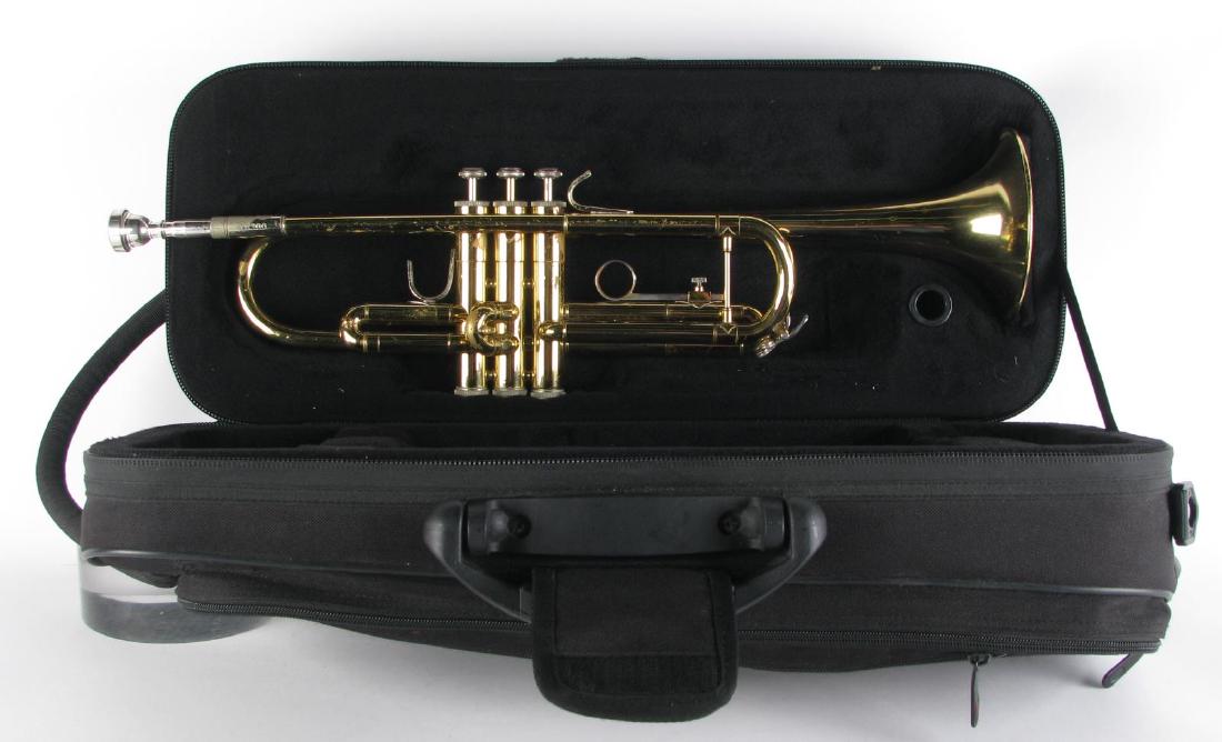 Bach TR300 Brass Trumpet with Case: Bach TR300 Brass Trumpet with Case, student trumpet with mouthpiece and valve oil, includes a Kaces fitted case, some dents and finish loss, 19.75" long without mouthpiece