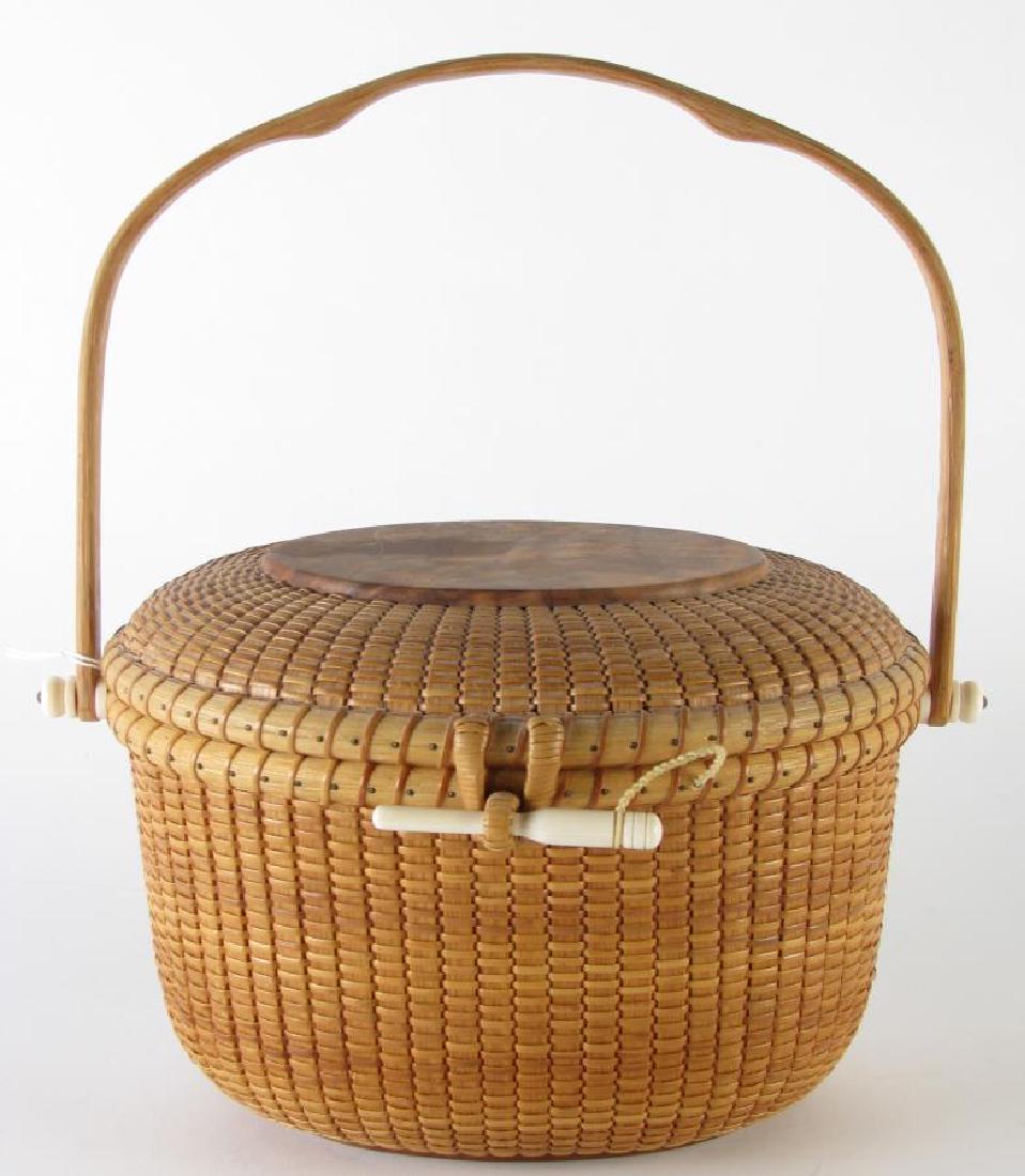 Martin Brown Handmade Nantucket Basket Purse: Martin Brown Handmade Nantucket Basket Purse, woven basket with beautiful burl wood accented top and oak ribs, trademark "notched" handle, signed on bottom "Martin Brown", 10.25" x 8" x 11.5"