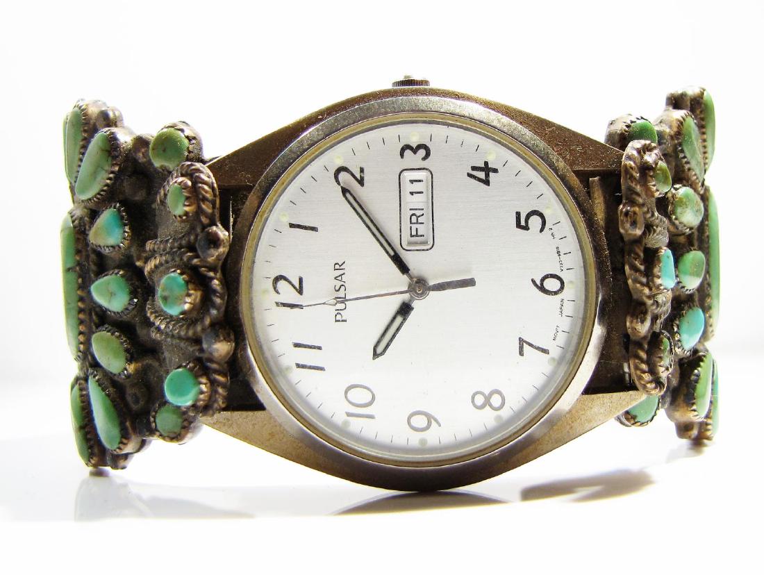 Old Pawn, Native American Watch Cuff, Begay: A vintage silver, Native American "old pawn" wristwatch cuff bracelet, with oval and teardrop cabochon turquoise in sawtooth settings, marked inside "VMB", attributed to Victor Moses Begay, Navajo, in