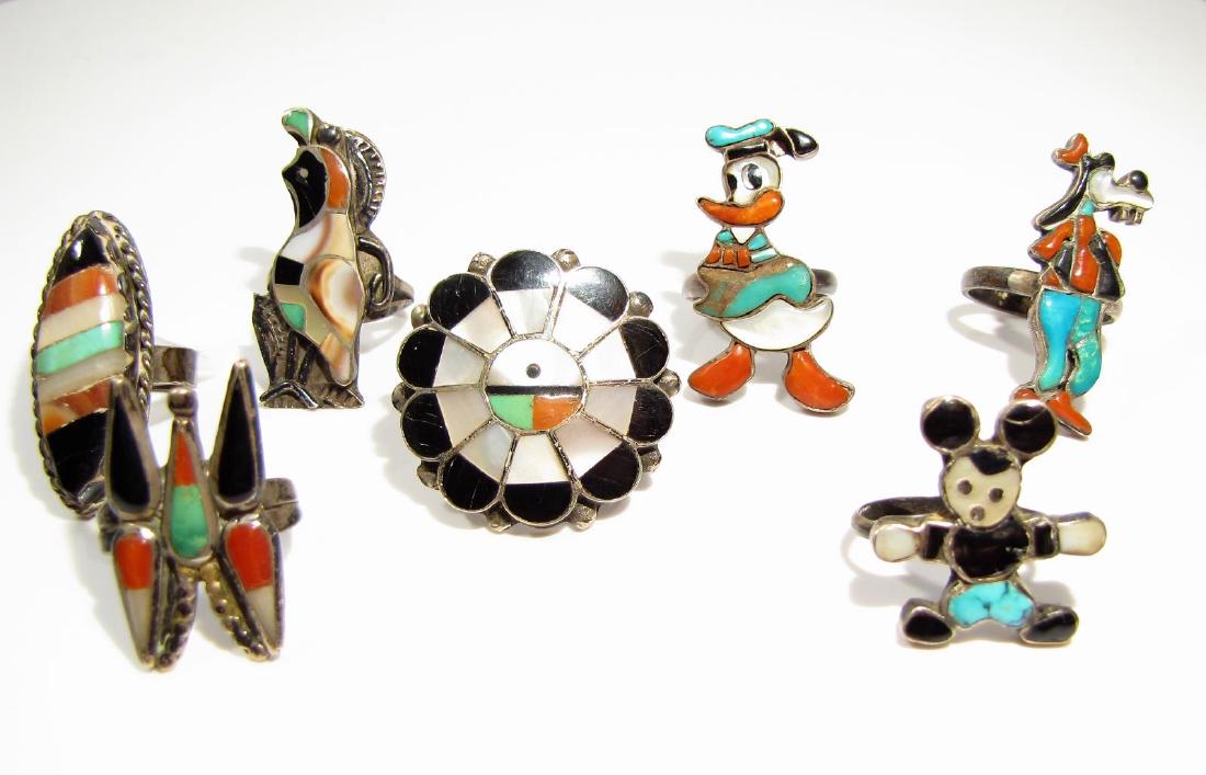 Group of 5, Southwest Silver Rings, Disney: A group of seven, southwest silver rings, including three Disney character rings (Donald Duck, Goofy, Mickey Mouse), and four others in various styles, each with a combination of onyx, turquoise, moth