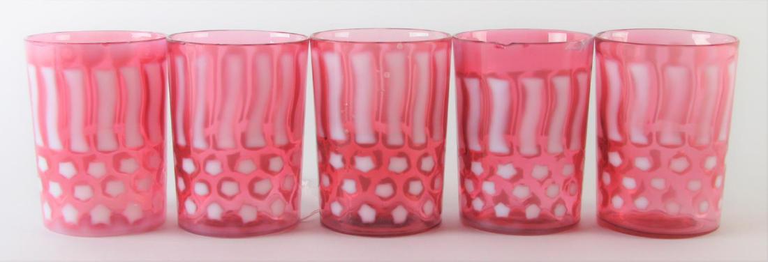 Set of Five Stars and Stripes Glass Tumblers: Set of Five Stars and Stripes Glass Tumblers, cranberry opalescent tumblers with three rows of stars, vertical stripes encircle the top, chips present on rims, 3.75" high