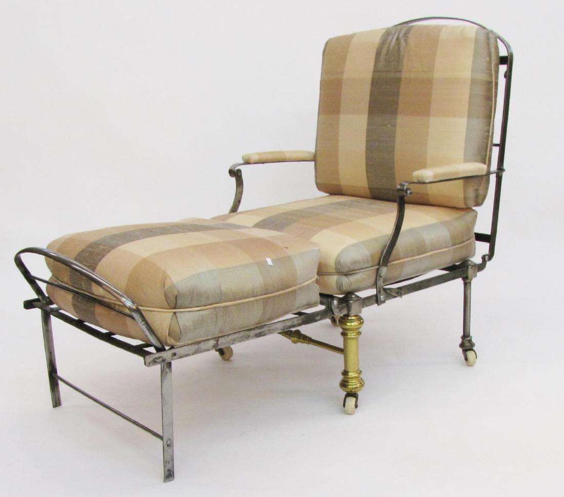 Antique French Campaign Style Lounge Chair: A late 19th/early 20th century French campaign style folding lounge chair, cast metal frame with two brass legs, porcelain casters, reclining back, with modern upholstered cushions (dimensions as pict