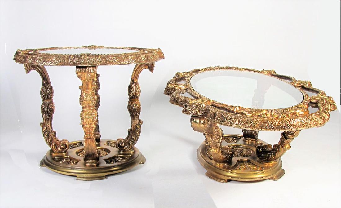 Ornate Cocktail and End Table Set: A highly ornate cocktail and end table set, wood and molded composition, gold finish (some wear) and faux marble painted rim, both with glass insert tops, end- 28.5 dia x 22.5h, cocktail- 55 x 29 x 16