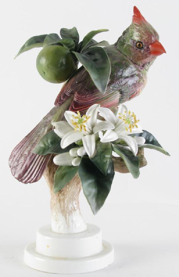 Dorothy Doughty Porcelain "Red Cardinal": Dorothy Doughty Porcelain "Red Cardinal", for Royal Worcester, depicting a cardinal perched in fruit tree, hallmarked and signed on bottom, 10" high Condition: repair to one leaf