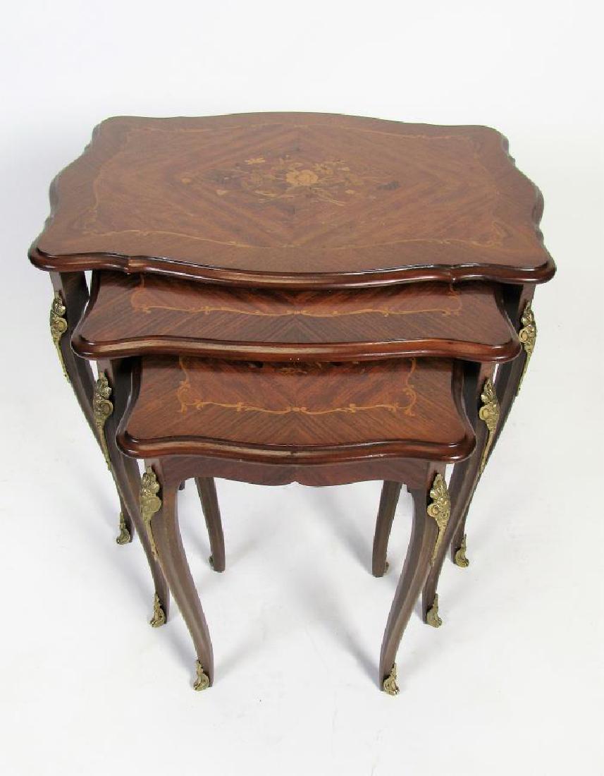 Set of Three Nesting Tables: A set of three nesting tables, inlaid floral and scroll motif decoration, brass ormolu (minor finish imperfections), 24" x 17" x 22"h (Largest table)