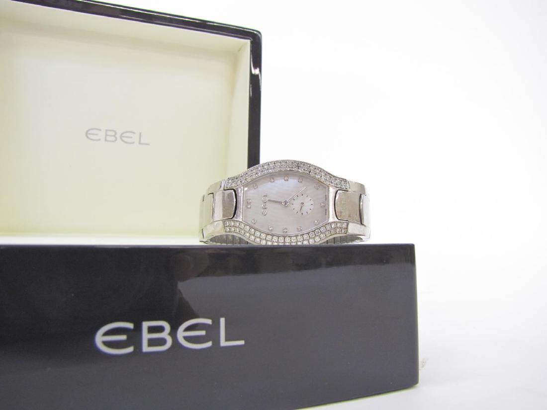 Lady's Ebel Beluga Watch, 18k, Diamonds: A lady's Ebel Beluga wristwatch, 18k white gold, with two row diamond bezel. mother-of-pearl face with diamond markers and second-hand subdial, retrofitted with later Speidel stretch band, with origin