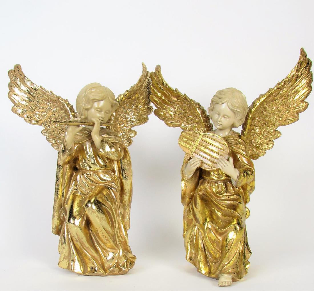 Two Gold Gilt Angel Musician Figures: Two gold gilt angel figures, both with spread wings, one playing flute and one playing harp, both of composite material, 13" x 7" x 17"