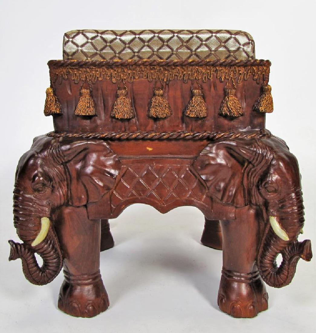 Carved Mahogany Elephant Footstool: A carved mahogany footstool, with elephant carvings, elephant feet, padded upholstered top, 20th century, 13" x 13" x 14"