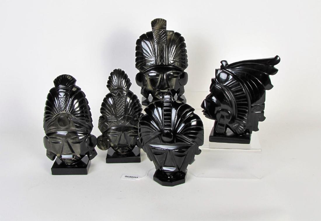 Group of Stone Carved Masks and Bust: Group of Stone Carved Masks and Bust, five total including: four Central American masks with ceremonial headdress; bust of Central American warrior in ceremonial headdress; 8.25"-9.75" high