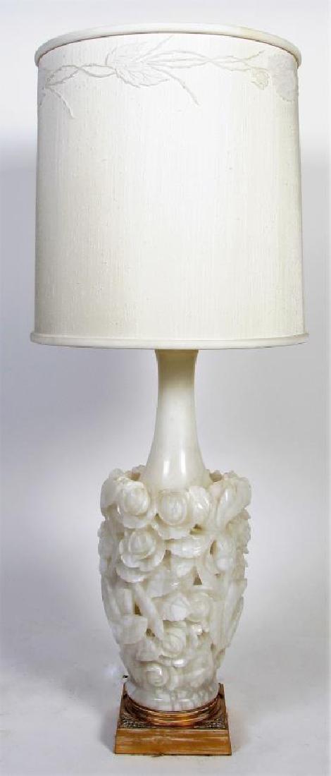 Carved Alabaster Banquet Lamp: A carved alabaster banquet lamp, flower and leaf motif, with banquet style (uplight) fixture, with high-quality shade, overall height 49"h, 11" diameter