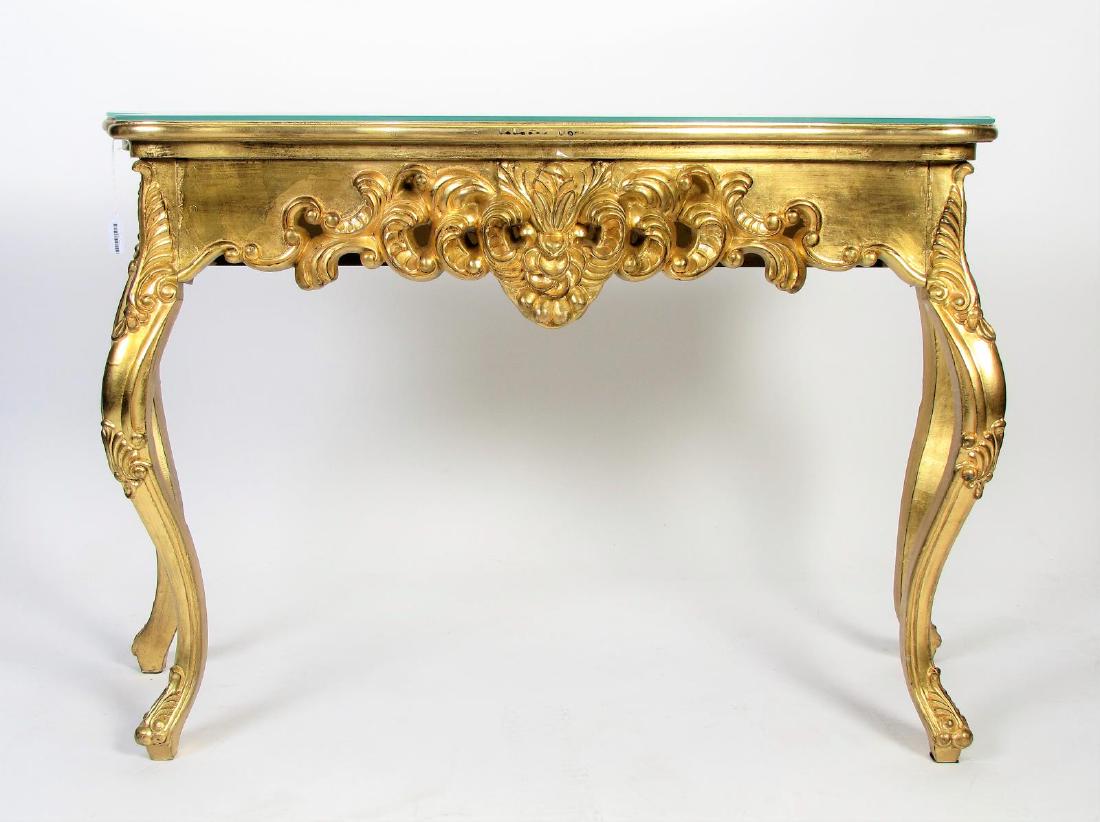 Carved French Console Table: A carved French console table, with leaf and floral carvings, gold leaf, early/mid 20th century, 45 x 13.5 x 29.5"h