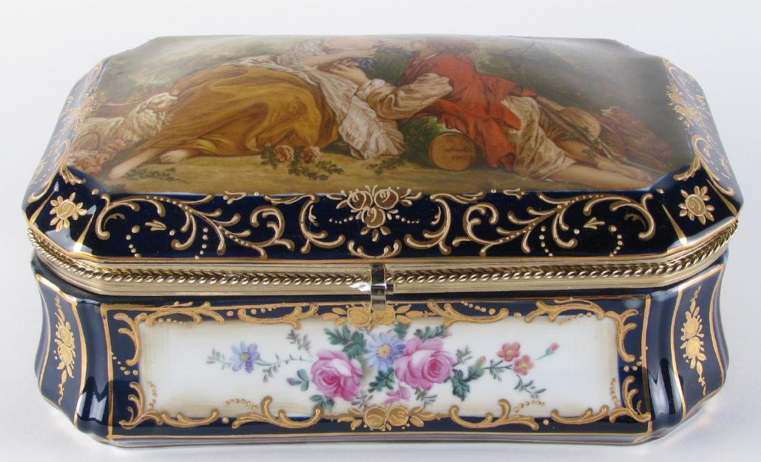 Cobalt Blue Porcelain Dresser Box: Cobalt Blue Porcelain Dresser Box, hand painted and enameled floral panels decorate each side, lid with hand painted romance scene, brass closure, inside decorated with hand painted flowers, unsigned,