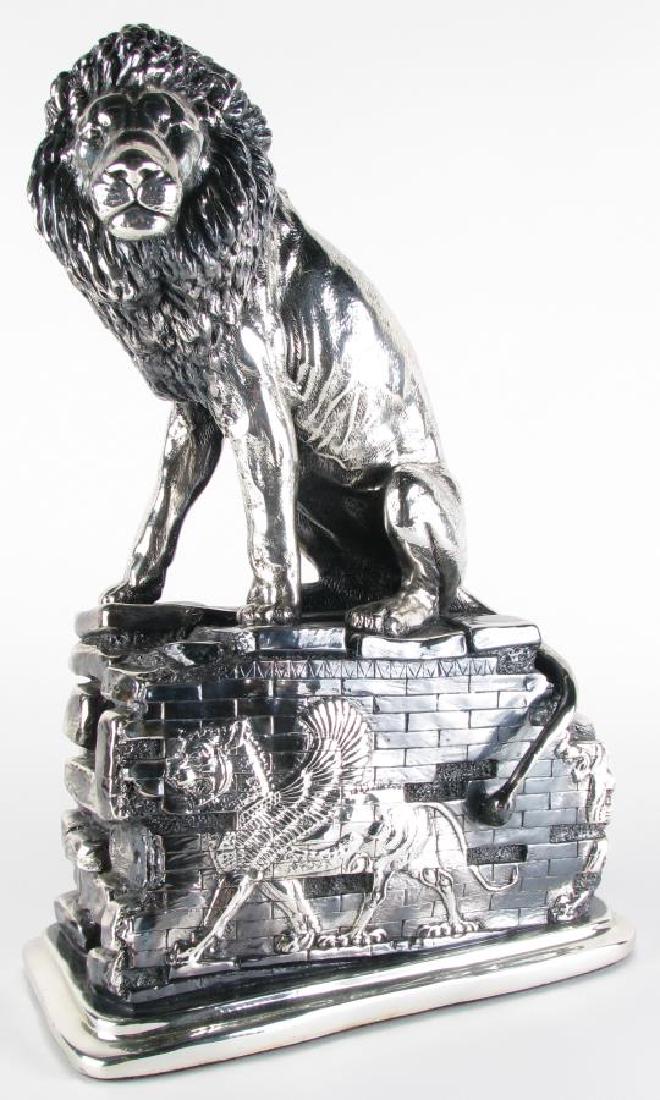 Plata Artistica Silver Clad Lion Sculpture: Plata Artistica Silver Clad Lion Sculpture, depicting a lion seated atop stone ruins, winged lion and omega decorated stones, plated in fine .999 Mexican silver, hallmarked on underside, 12" x 7" x 18