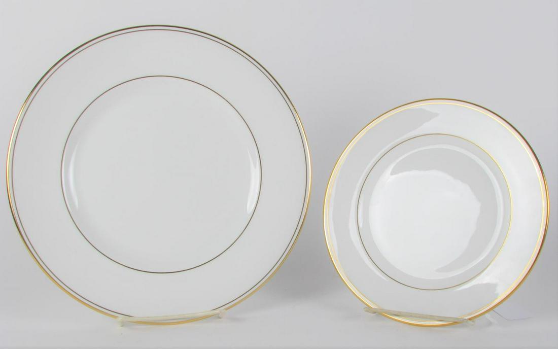 Set of Lenox Federal Gold China: A set of Lenox Federal Gold china forty-eight total including twenty-four 10.5" diameter dinner plates and twenty-four salad plates, white, trimmed in gold, hallmarked on underside