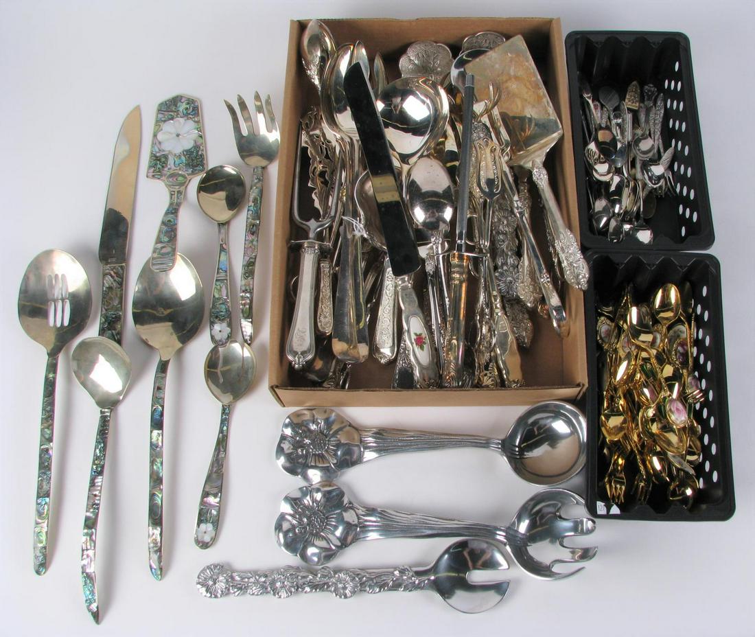 Flatware and Serving Pieces: Flatware and serving pieces including gold plated spoons and forks; silver plate spoons and forks; meat fork and knife; and reticulated flat server; pair of tongs; salad servers; casserole servers; et