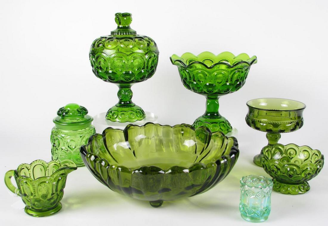 Fifteen Green Decorated Glass Items: Fifteen green decorated glass items including five lidded compotes; four compotes; lidded jar; three creamers; a footed bowl, 11.5" diameter; and a Carnival glass toothpick holder