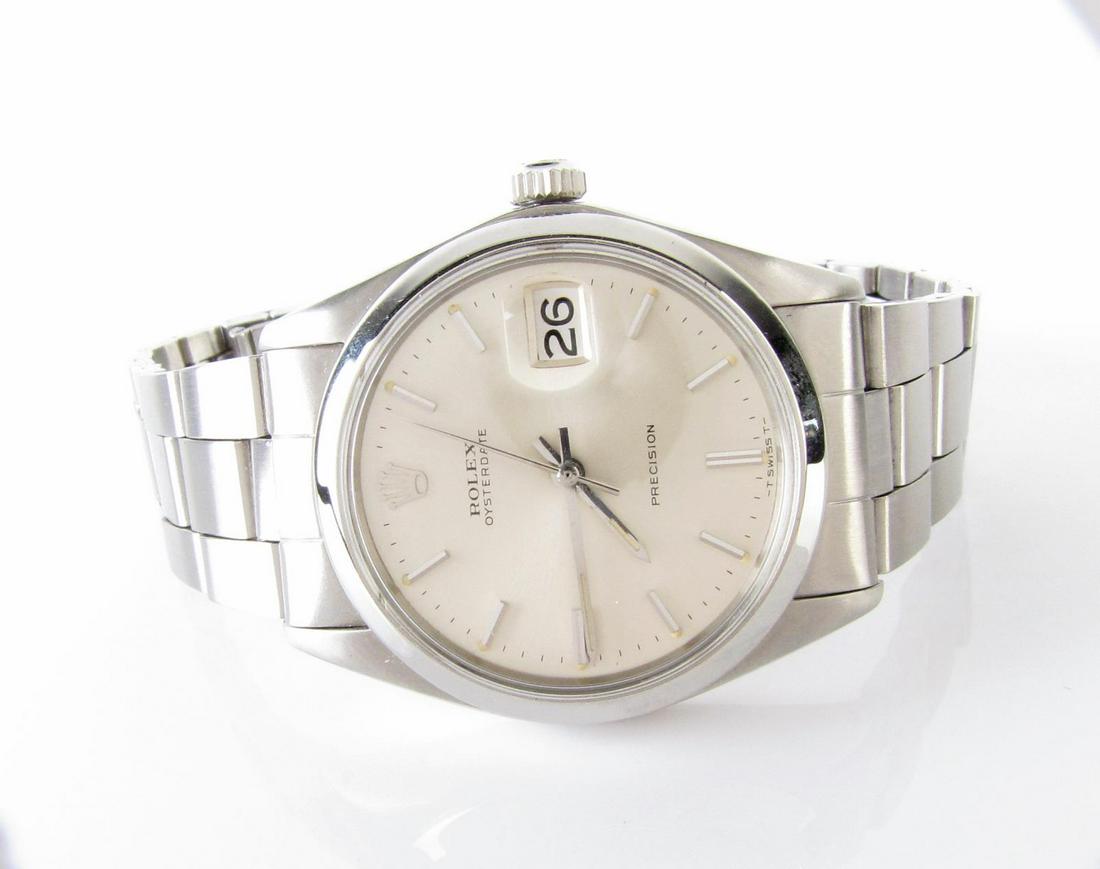 Rolex Oyster Wristwatch: A Rolex Oyster wristwatch with date, stainless steel, manual wind, 1968 model #6694, 34mm case, vintage.