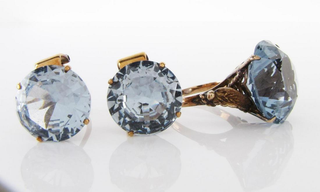 Vintage 14K Aquamarine Ring and Earrings: A vintage 14K yellow gold aquamarine jewelry set including a pair of clip earrings, each containing a 14mm round aquamarine and an antique ring with rope and pierced design containing a 17.5 x 12mm aq