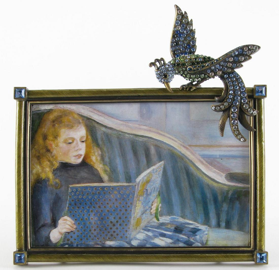 Jay Strongwater Picture Frame: A Jay Strongwater rectangular picture frame with peacock perched at top with Swarovski crystal decorations, Jay Strongwater badge on back, 6.5" x 6.75" high, holds a 6" x 4" photo
