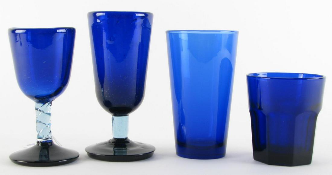 Three Sets of Cobalt Glassware: Three sets of cobalt glassware including seventeen Libby rocks glasses; fifteen water goblets; sixteen wine glasses; and one tumbler; 4" - 6.75" high