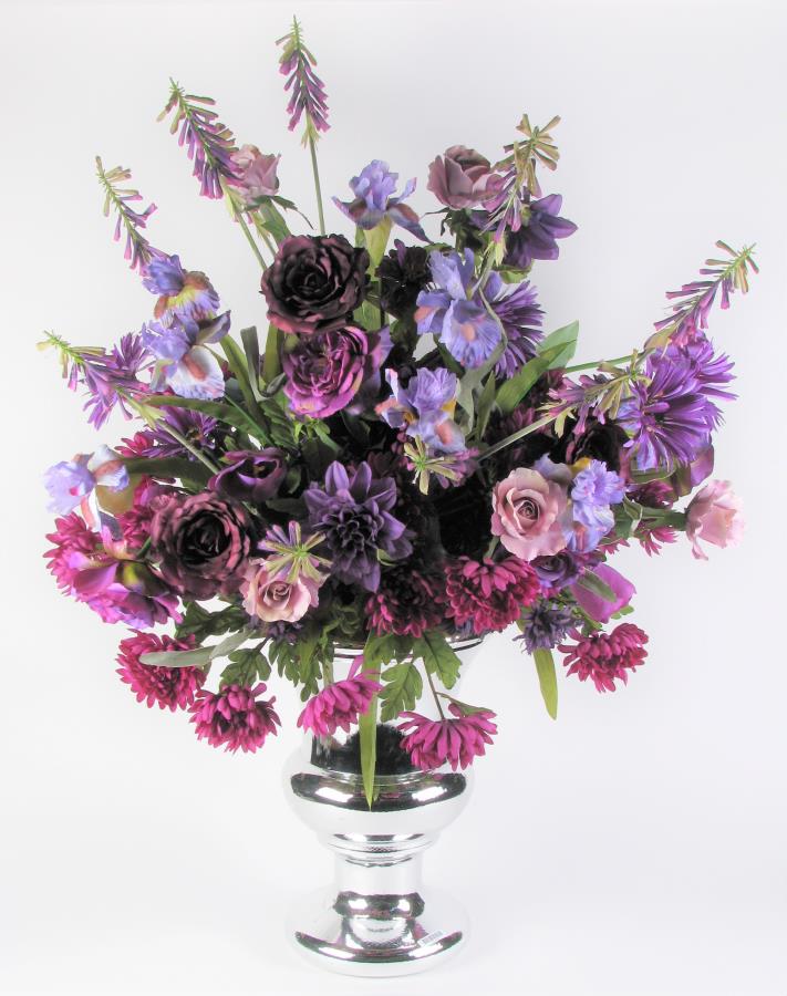 Artificial Floral Arrangement: A silver composite urn holding purple and lavender irises, roses and daisies, 45" tall