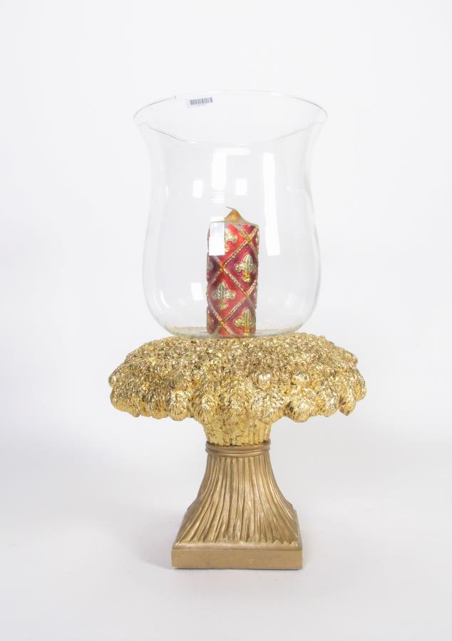 Glass & Metal Floor Decoration: A glass hurricane and metal floor decoration with gold gilt cast metal base, a red and gold candle inside, by Austin Production, 17" diameter, 28" high, .25" chip on top rim of glass