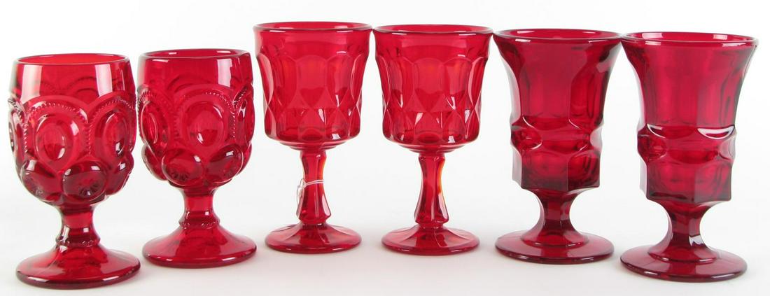 Ruby Glass Stemware: Sixty-three ruby glass stemware glasses including (14) wine glasses; (15) water goblets; and (34) wine glasses