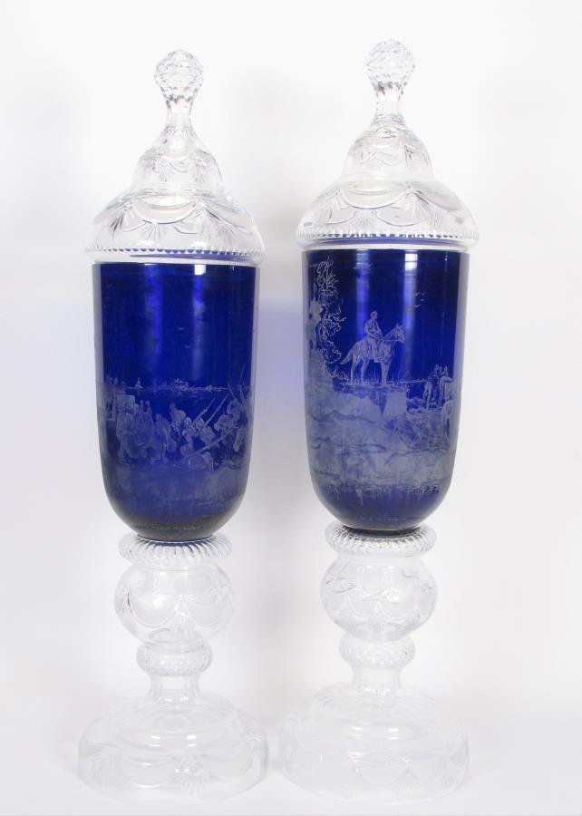 Pair Ltd Ed. Palatial Cobalt and Clear Floor Vases: A pair of limited edition palatial lidded floor vases, cobalt bodies with etched battle scenes, feet and lids with cut fan and frosted diamond decoration, large faceted finials, 54" high, 13" diameter