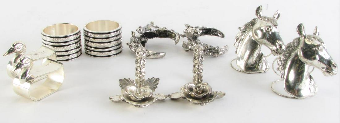 Decorated Metal Napkin Rings: Several sets of metal napkin rings including eight horse themed; eight cylindrical with geometric decoration; sixteen duck form; nine floral decorated; and four horse bust (illegibly signed and dated