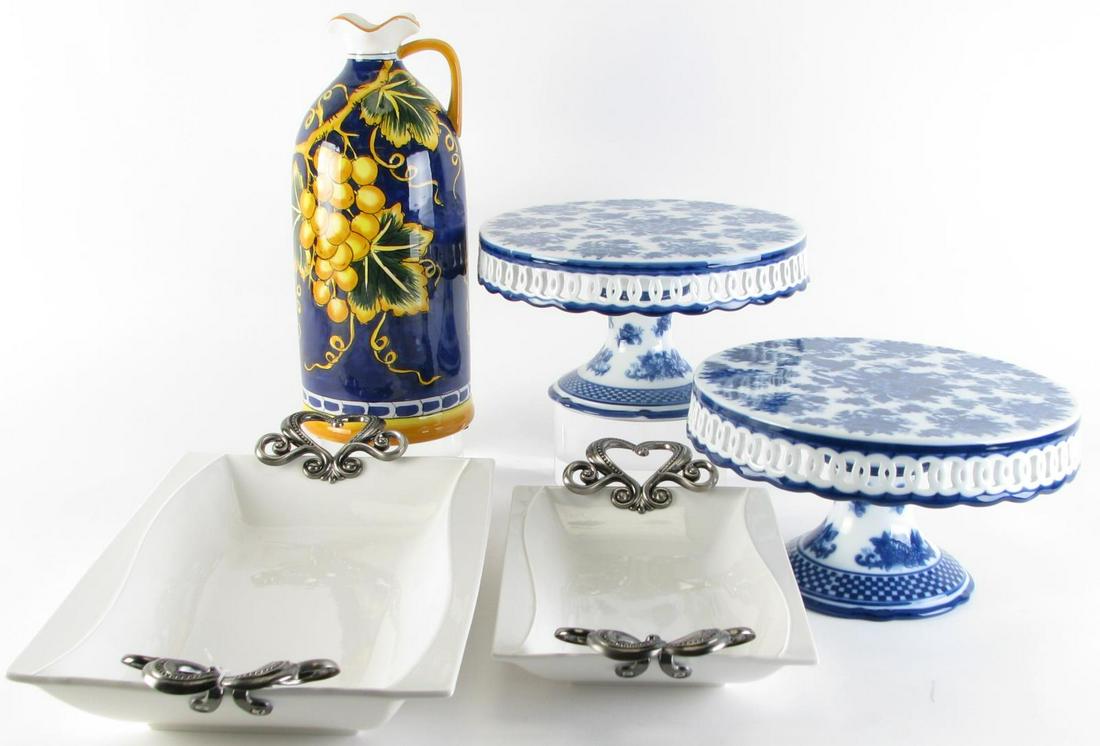 Five Decorated Porcelain Items: Five decorated porcelain items including a pair of blue and white floral decorated cake stands with pierced aprons; two Crown Baccara handled serving trays; bottle with Italian inspired cobalt and fru