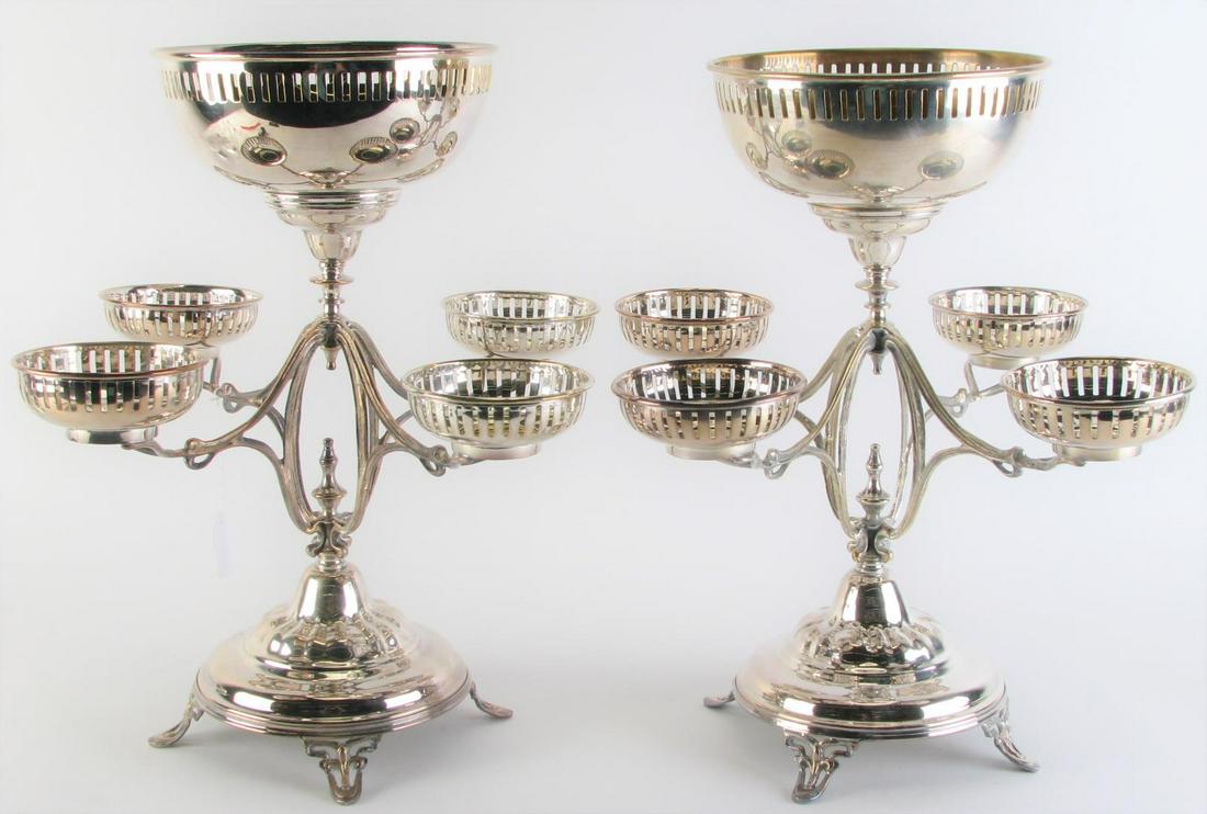 Pair of Silver Plate Epergnes: A pair of silver plate epergnes, each with five removable silver plate bowls with pierced rims, reverse finial decoration on footed base, 17" diameter, 17.25" high