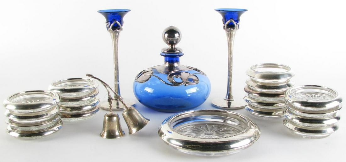 Sterling Decorative Table Setting Accessories: A group of sterling silver decorative table setting accessories including Frank M. Whiting & Co. wine bottle coaster and seventeen matching coasters; Mexican sterling two-bell set; a pair of cobalt st