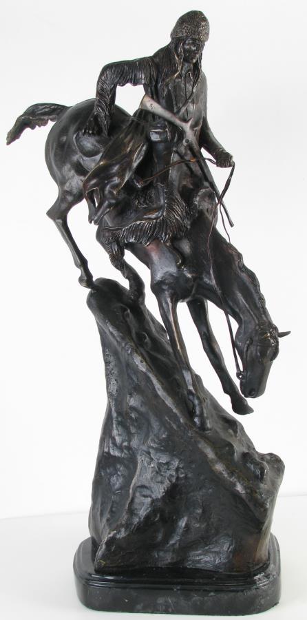 After Frederic Remington 'Mountain Man' Sculpture: After Frederic Remington 'Mountain Man' Sculpture, a patinated cast metal sculpture depicting a man descending a mountain on horseback, signed in cast "Frederic Remington", 27.5" high