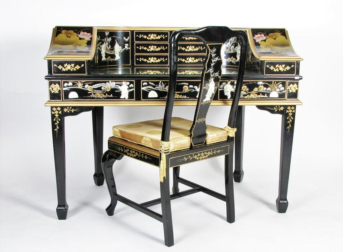 Chinese Chinoiserie Carlton House Desk: A Chinese Chinoiserie Carlton House desk, black lacquer with inlaid mother of pearl and semi-precious stone inlay decoration, with glass top, legs can be removed for moving, with matching chair, 50" x