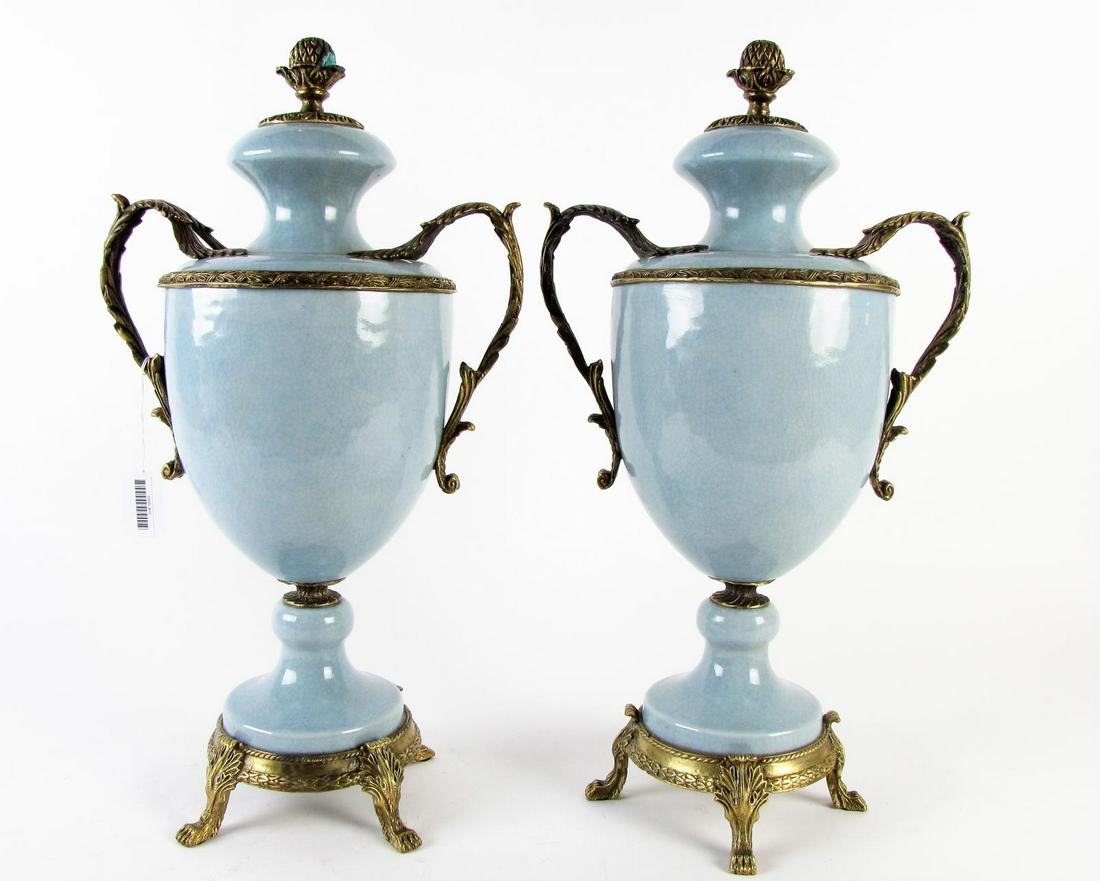 Pair of French Mounted Porcelain Urns: Pair of French Mounted Porcelain Decorative Urns, blue craquelure glazed urns with mounted ormolu and handles, on cast metal paw foot base, 19.5" high