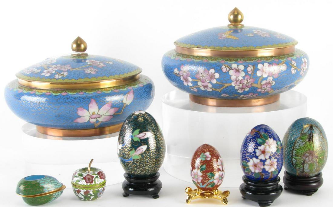 Eight Cloisonne Decorative Accessories: Eight cloisonné decorative accessories including a pair of lidded jars with floral and butterfly decoration; five eggs (four with stands); and a miniature cloisonné apple with removable lid; 1" to 3