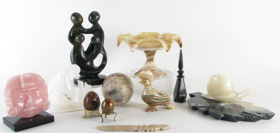 Eleven Stone Carved Decorative Accessories: Eleven Stone Carved Decorative Accessories, including: onyx compote; carved sphere; two eggs with stands; onyx bird figure; pink quartz carved mask on vase; white quartz bird figural grouping; black p